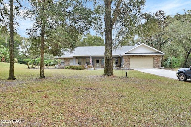 single story home with a front lawn, covered porch, and a garage