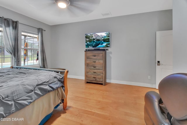 bedroom featuring ceiling fan and light hardwood / wood-style floors