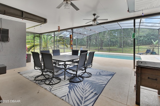 view of patio with glass enclosure and ceiling fan