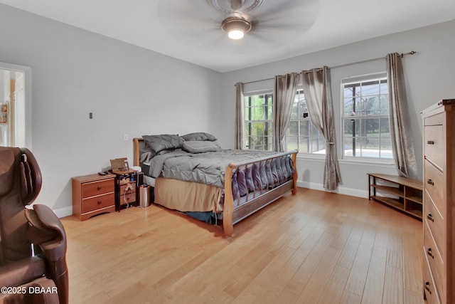 bedroom with hardwood / wood-style floors and ceiling fan