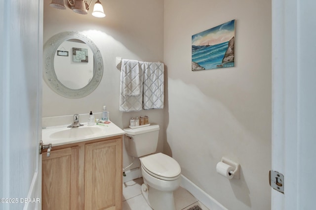 bathroom with tile patterned floors, vanity, and toilet