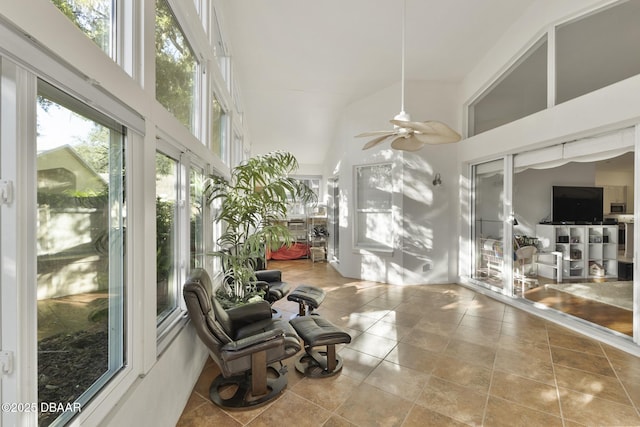 sunroom featuring ceiling fan