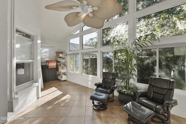 sunroom featuring vaulted ceiling and ceiling fan