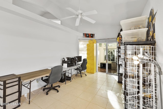 tiled office space with lofted ceiling and ceiling fan