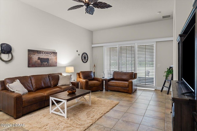 tiled living room featuring ceiling fan