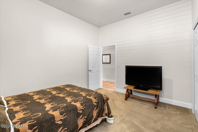 carpeted bedroom featuring vaulted ceiling