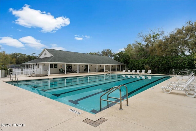 view of swimming pool with a patio