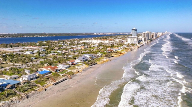 bird's eye view featuring a beach view and a water view