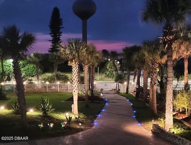 view of yard at twilight