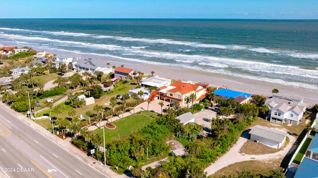 bird's eye view featuring a water view and a view of the beach