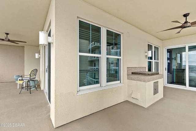 view of patio featuring ceiling fan