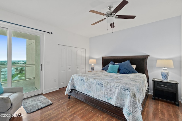 bedroom featuring ceiling fan, dark hardwood / wood-style flooring, access to outside, and a closet