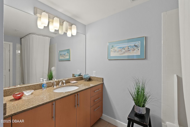 bathroom with tile patterned flooring and vanity