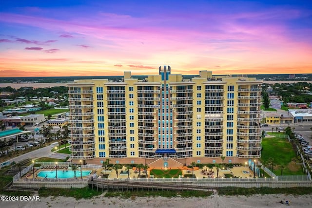 view of outdoor building at dusk