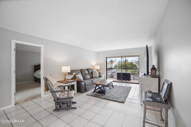 living room with a textured ceiling and light carpet