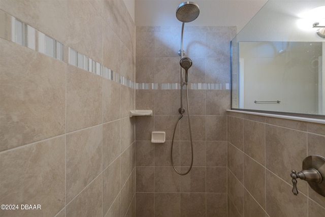 bathroom with tiled shower