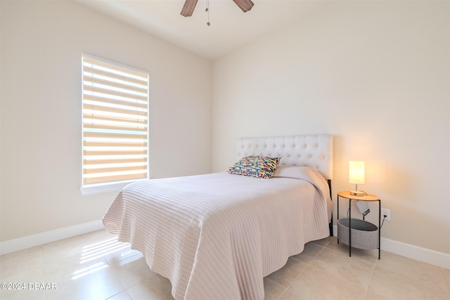 bedroom with light tile patterned floors and ceiling fan