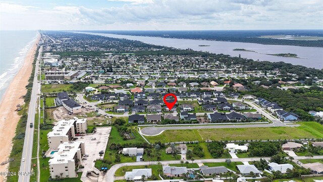 aerial view featuring a beach view and a water view