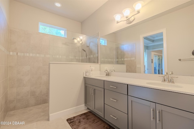 bathroom with vanity, tile patterned floors, and tiled shower