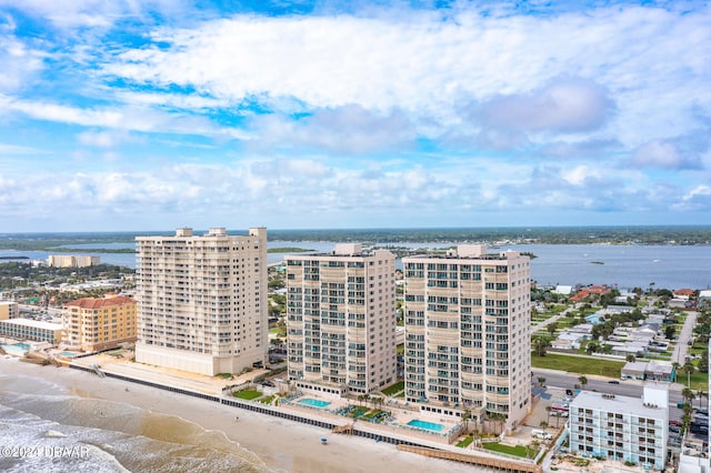 aerial view featuring a water view and a beach view