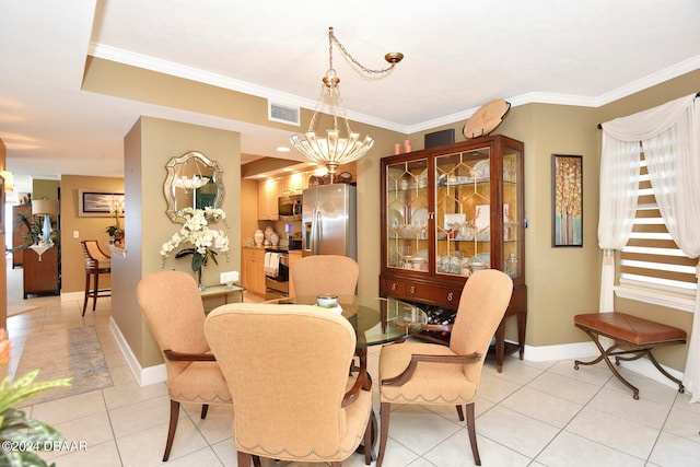 dining space featuring light tile patterned floors, an inviting chandelier, and ornamental molding