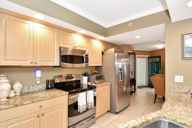 kitchen featuring stainless steel appliances, light tile patterned floors, ornamental molding, light stone countertops, and light brown cabinets