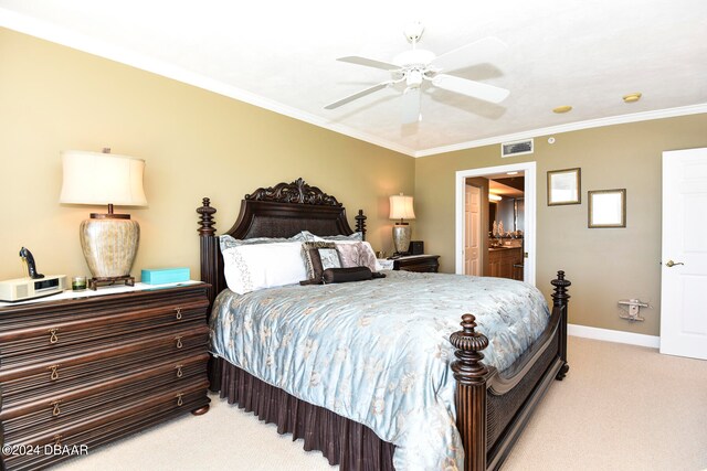 bedroom with ceiling fan, light colored carpet, connected bathroom, and ornamental molding