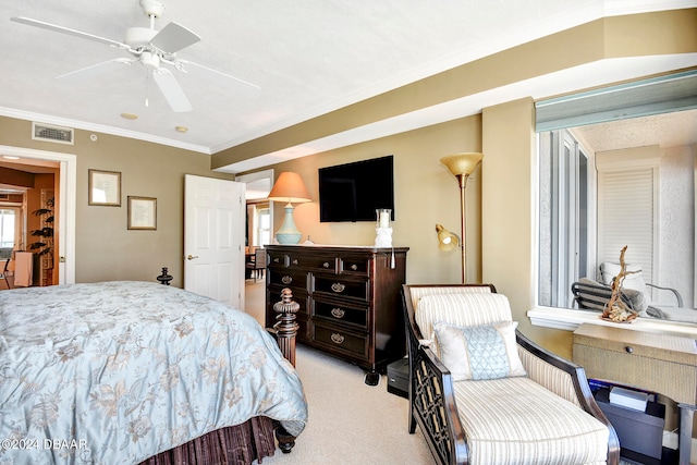 bedroom featuring light colored carpet, ceiling fan, and crown molding