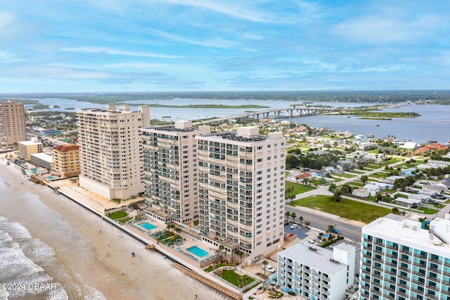 bird's eye view with a beach view and a water view