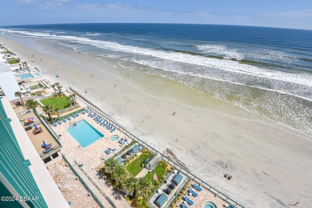 birds eye view of property featuring a view of the beach and a water view