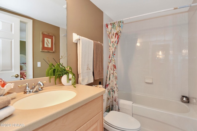 full bathroom with shower / bath combo with shower curtain, vanity, and toilet