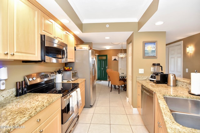 kitchen with stainless steel appliances, hanging light fixtures, ornamental molding, light tile patterned flooring, and light brown cabinets