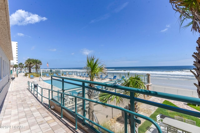 exterior space with a beach view and a water view