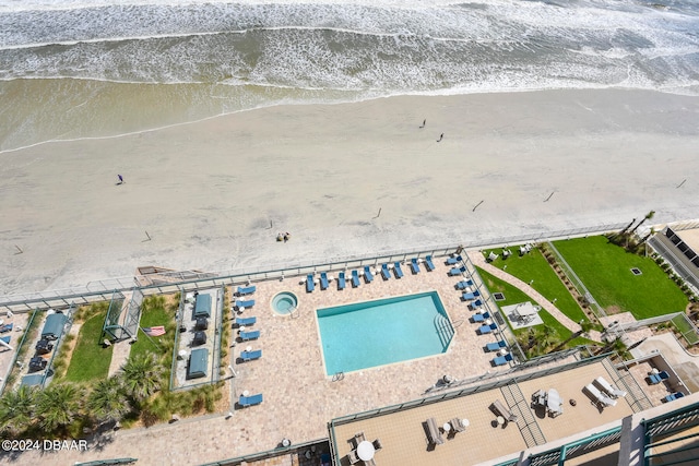 aerial view featuring a water view and a view of the beach