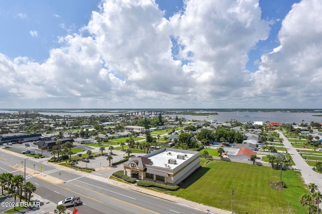 birds eye view of property with a water view