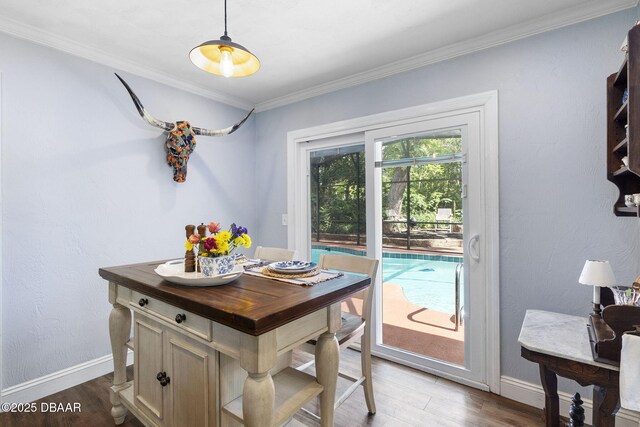 552 Hamlet Dr, Port Orange, FL 32127 - dining room featuring wood finished floors and ornamental molding