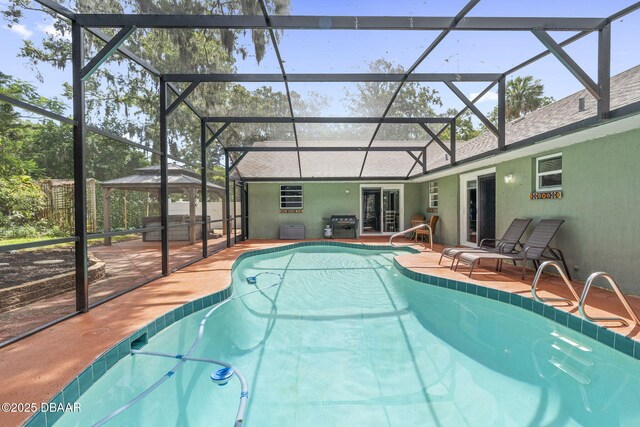 552 Hamlet Dr, Port Orange, FL 32127 - outdoor pool featuring a gazebo, a patio area, french doors, and glass enclosure