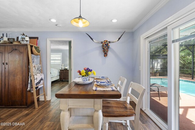 552 Hamlet Dr, Port Orange, FL 32127 - dining space with ornamental molding, dark wood finished floors, and recessed lighting