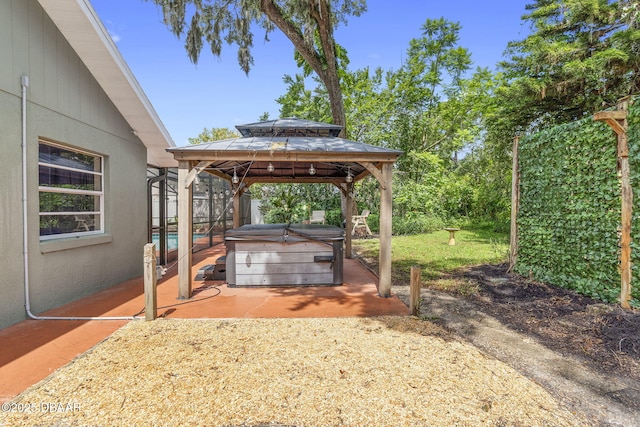552 Hamlet Dr, Port Orange, FL 32127 - view of yard with a hot tub, a patio, and a gazebo