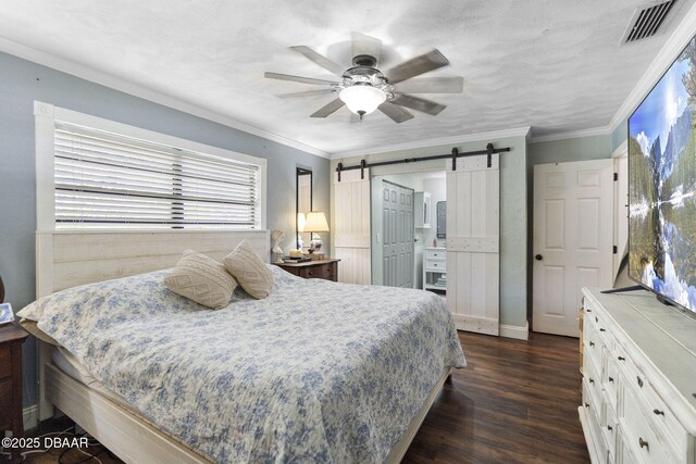 552 Hamlet Dr, Port Orange, FL 32127 - bedroom featuring a barn door, dark wood-style floors, crown molding, and a ceiling fan