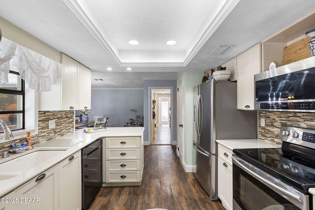 552 Hamlet Dr, Port Orange, FL 32127 - kitchen with stainless steel appliances, recessed lighting, light countertops, a peninsula, and tasteful backsplash
