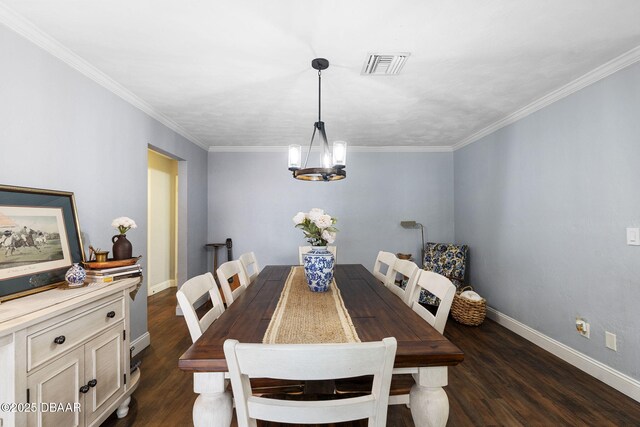 552 Hamlet Dr, Port Orange, FL 32127 - dining room with a chandelier, dark wood-style floors, and crown molding