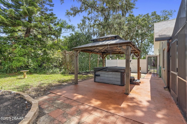 552 Hamlet Dr, Port Orange, FL 32127 - view of patio / terrace featuring a hot tub and a gazebo