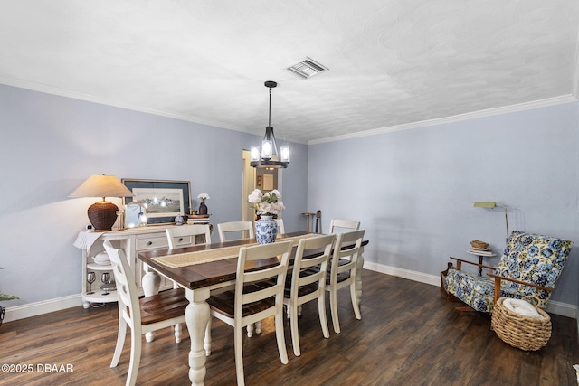 552 Hamlet Dr, Port Orange, FL 32127 - dining room featuring a chandelier, wood finished floors, and ornamental molding