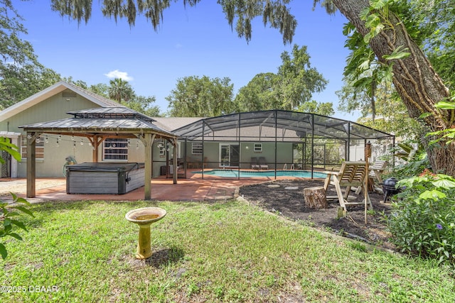 552 Hamlet Dr, Port Orange, FL 32127 - back of property featuring a hot tub, a yard, a patio, an outdoor pool, and a gazebo