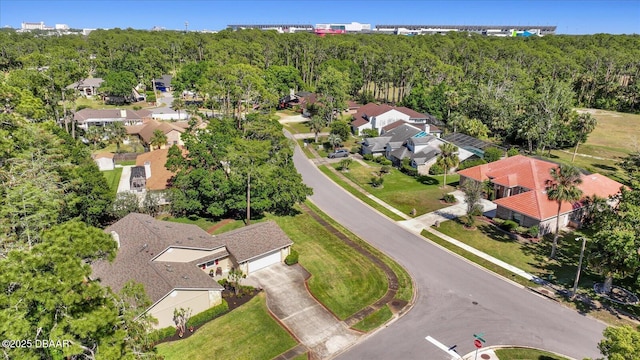 birds eye view of property featuring a residential view and a forest view