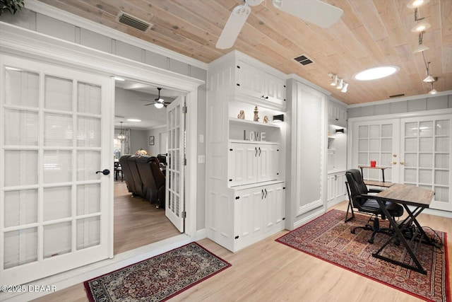 home office with wooden ceiling, french doors, visible vents, and ceiling fan