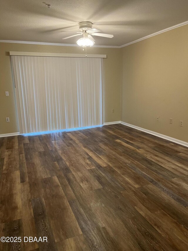 940 Village Trl Unit 6-109, Port Orange, FL 32127 - unfurnished room with a ceiling fan, dark wood-type flooring, baseboards, and ornamental molding