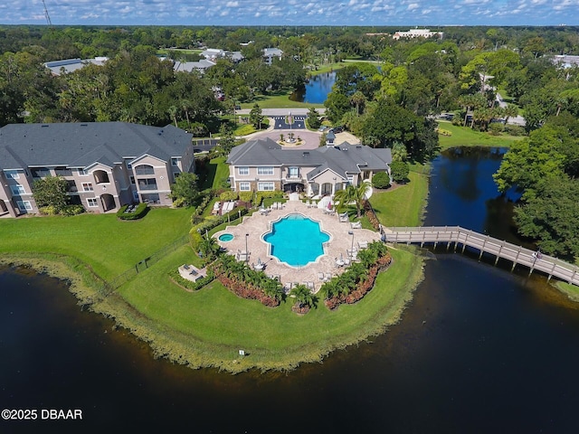940 Village Trl Unit 6-109, Port Orange, FL 32127 - bird's eye view of a pool, a nearby body of water, and a tree filled landscape
