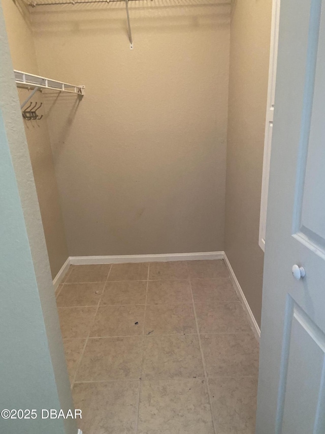 940 Village Trl Unit 6-109, Port Orange, FL 32127 - spacious closet featuring light tile patterned floors
